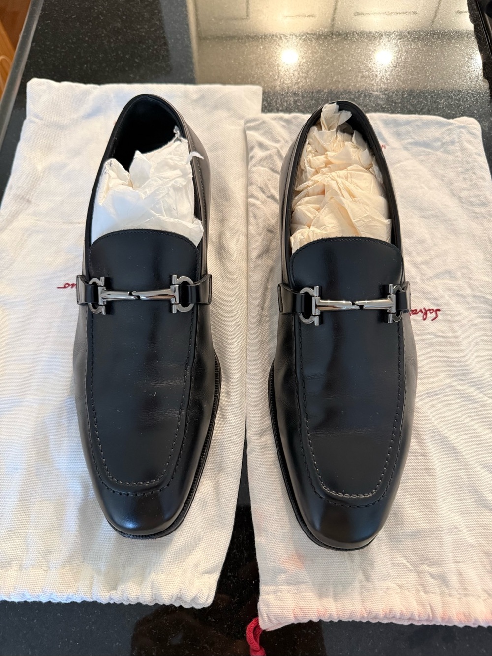 Salvatore Ferragamo Black Leather Loafers with Silver Hardware.